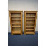 A PAIR OF SOLID OAK FRENCH STYLE OPEN BOOKCASES, each with four adjustable shelves, width 101cm x