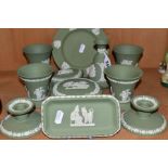 ELEVEN PIECES OF WEDGWOOD GREEN JASPERWARE, including a pair of dwarf candlesticks, two pairs of