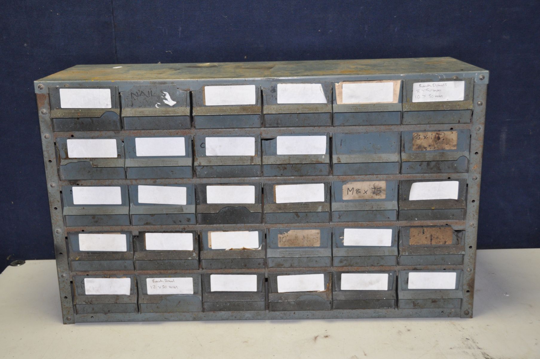 AN INDUSTRIAL METAL WORKSHOP DRAWER UNIT with thirty plastic 'Well construct' drawers , width 90cm
