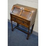 AN EARLY TO MID 20TH CENTURY BUREAU, with a single drawer, on turned legs united by a single