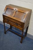 AN EARLY TO MID 20TH CENTURY BUREAU, with a single drawer, on turned legs united by a single