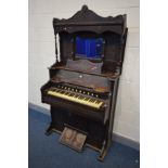 AN EDWARDIAN 'W W PUTMAN' MAHOGANY PUMP ORGAN, with a mirrored top, width 108cm x depth 52cm x