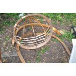 A MODERN BENTWOOD GARDEN CORACLE CHAIR ON STAND , seat is 118cm in diameter semi hemispherical in