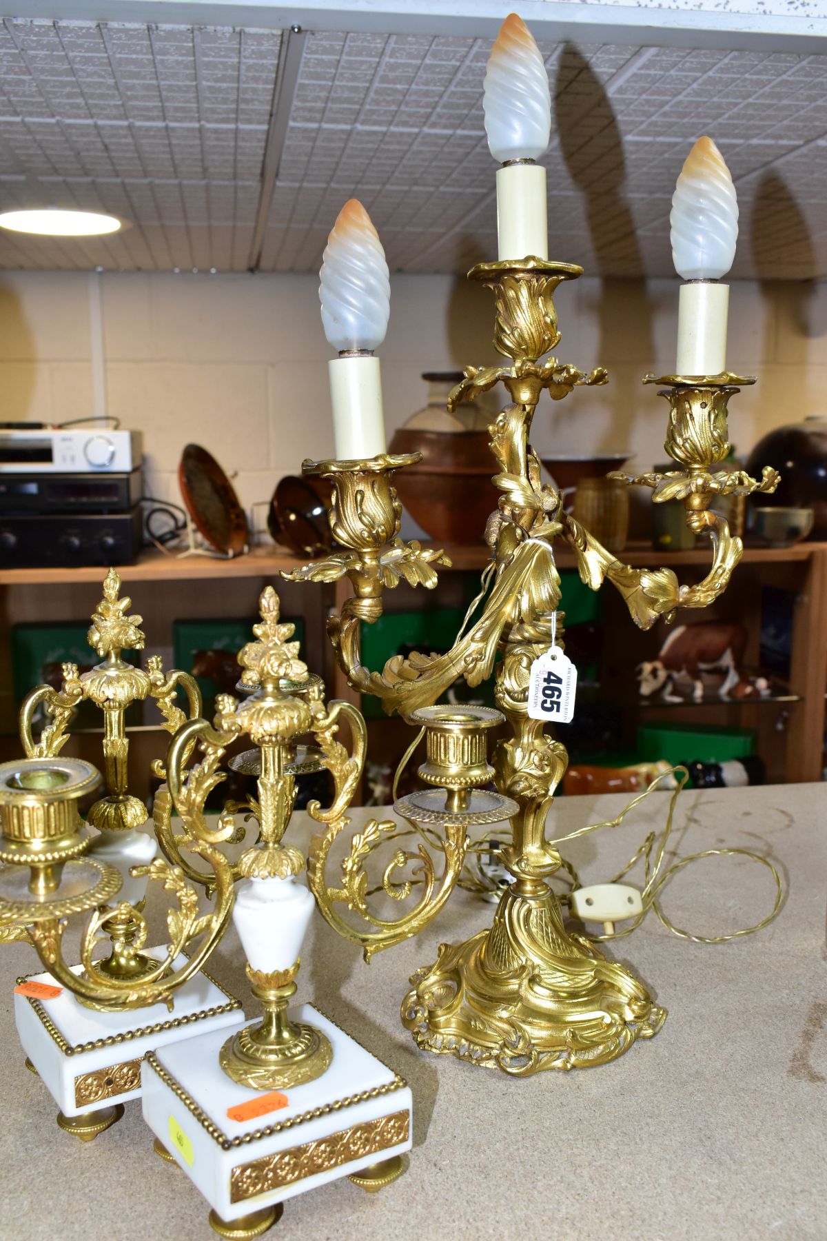 A GILT METAL TABLE LAMP IN THE FORM OF A THREE LIGHT CANDELABRA, height approximately 45cm excluding