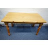 A PINE KITCHEN TABLE with a single drawer, length 135cm x depth 75cm x 77cm