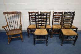 A SET OF SIX OAK RUSH SEATED LADDERBACK CHAIRS, all chairs varnished differently, along with spindle