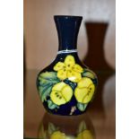 A SMALL MOORCROFT POTTERY BUD VASE, Buttercup pattern, impressed and painted backstamp, height 10.