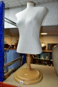 A SPERLING MODELS FEMALE MANNEQUIN BODY, height adjustable via a chrome column attached to a