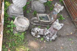 THREE FOX GARDEN FIGURES AND A SMALL URN all composite in construction (4)