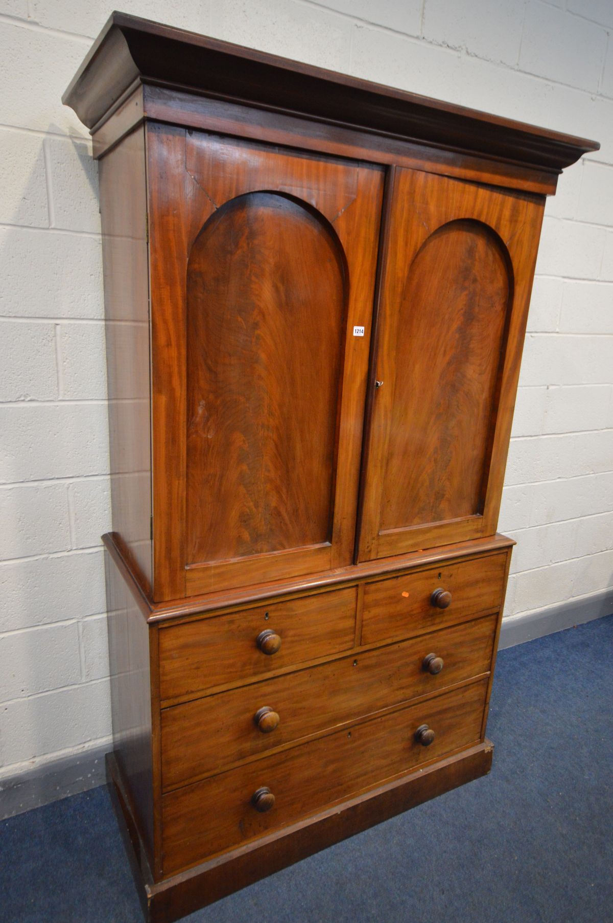 A VICTORIAN FLAME MAHOGANY LINEN PRESS, overhanging cornice, the double panelled doors enclosing - Image 2 of 7