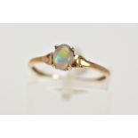 A YELLOW METAL OPAL RING, designed with a claw set, oval opal cabochon, plain polished band