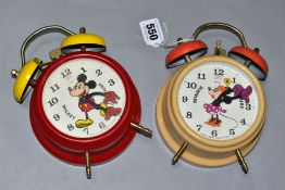 TWO GERMAN MADE MICKEY AND MINNIE MOUSE ALARM CLOCKS, of metal and plastic construction, both appear