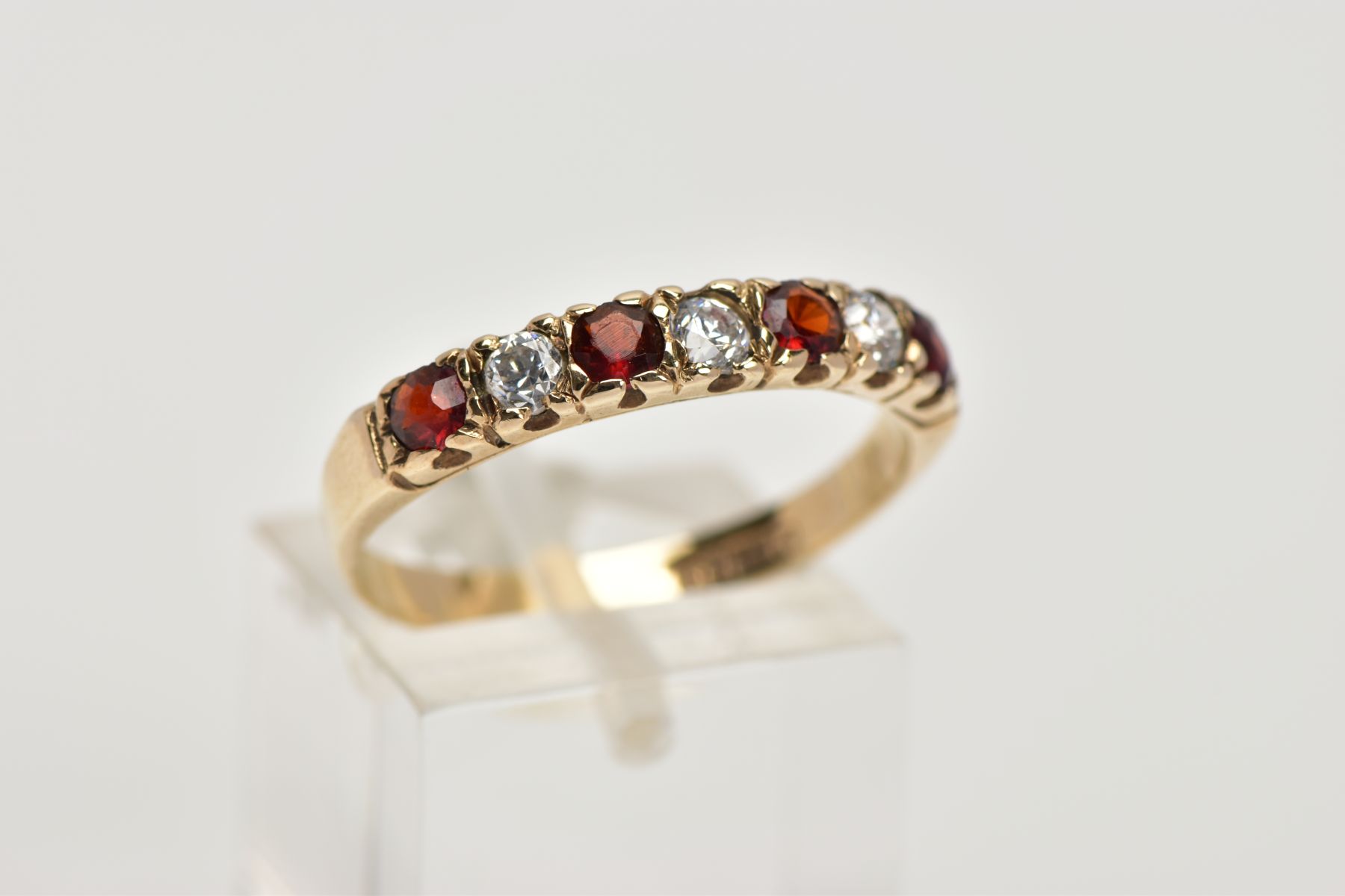 A 9CT GOLD GARNET AND CUBIC ZIRCONIA HALF ETERNITY RING, designed with a row of four circular cut - Image 4 of 4