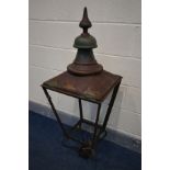 A DISTRESSED SQUARE TAPERED COPPER LANTERN, marked W Parkinson & Co, London and Birmingham, 41cm