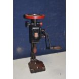 A VINTAGE IXION MANUAL DRILL PRESS overpainted in black and red paint in working order ( split to