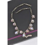 A WHITE METAL AND FAUX OPAL CABOCHON NECKLET, designed with eight circular links each set with a