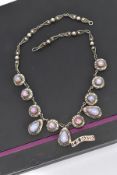 A WHITE METAL AND FAUX OPAL CABOCHON NECKLET, designed with eight circular links each set with a