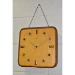 A SMITHS SECTRIC MID CENTURY ELECTRIC WALL CLOCK, beech and mahogany veneer construction,