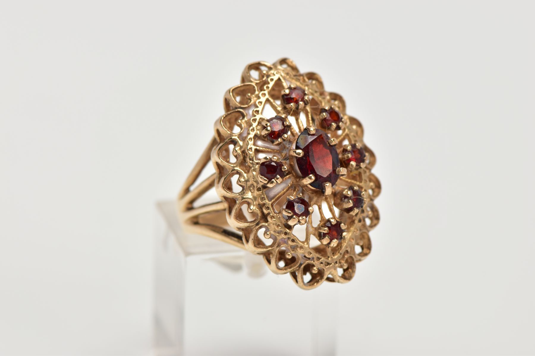 A 9CT GOLD GARNET DRESS RING, of a large openwork marquise shape, set with circular cut garnets, - Image 4 of 4