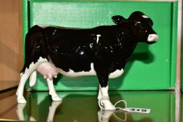 A BOXED BESWICK RARE BREED SHETLAND COW, No 4112 designed b y Robert Donaldson, Beswick crest