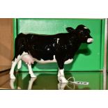 A BOXED BESWICK RARE BREED SHETLAND COW, No 4112 designed b y Robert Donaldson, Beswick crest