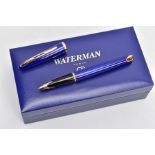 A BOXED WATERMAN CARENE FOUNTAIN PEN, gloss blue body and gold trim detail, 18k gold nib, together