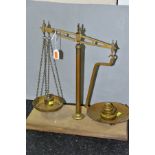 AN EARLY 20TH CENTURY BALANCE BEAM SCALE WITH WEIGHTS, impressed G.R mark with calibration