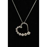 A MODERN 9CT WHITE GOLD DIAMOND HEART AND CHAIN, a witch's graduated diamond heart pendant,