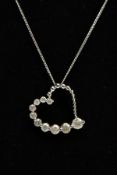 A MODERN 9CT WHITE GOLD DIAMOND HEART AND CHAIN, a witch's graduated diamond heart pendant,