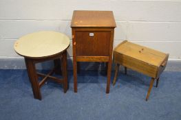 AN EARLY 20TH CENTURY SEWING BOX ON LEGS, an oak sewing box and a circular Formica occasional with a