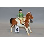 A BESWICK GIRL ON PONY, No 1499, skewbald, Beswick crest backstamp, height 14cm (Condition:- paint
