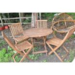 A MODERN HARDWOOD FOLDING GARDEN TABLE 90cm in diameter with four folding chairs (5)