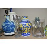 A GROUP OF LAMP BASES, GLASS LIGHT SHADES, CANDLE HOLDERS, etc, comprising two coloured leaded glass