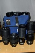 A NIKON AF-S ED DX VR 18-140mm f3.5 lens, a Nikon AF-S G ED 70-300mm f4.5 lens, a Tamron Sp 70-210mm