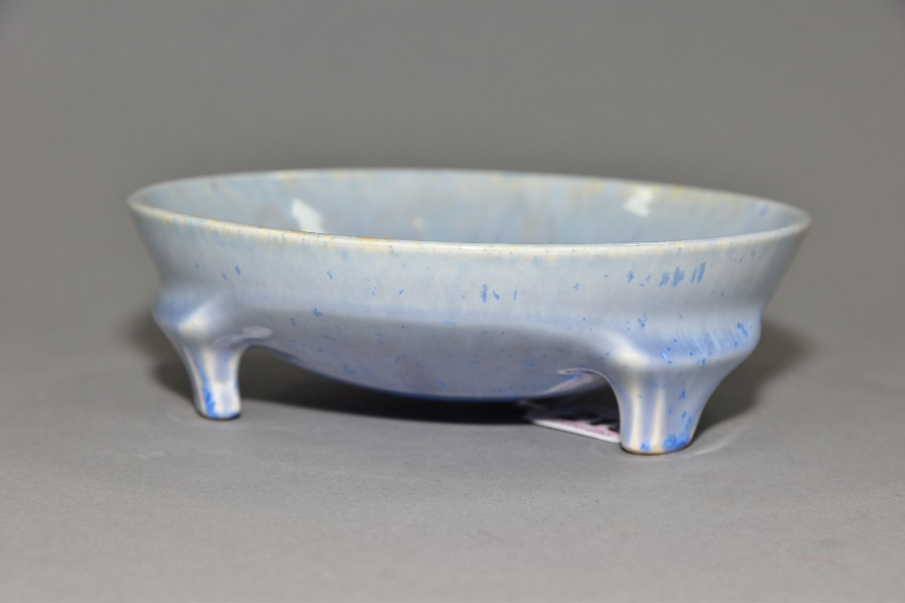 RUSKIN POTTERY, a shallow bowl raised on three feet, blue crystalline and streaked glaze, - Image 2 of 5