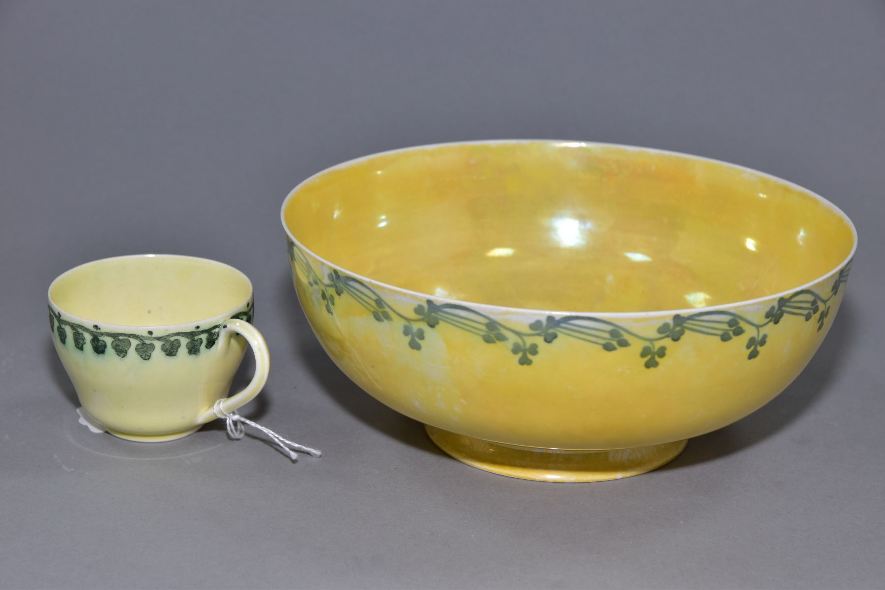 RUSKIN POTTERY, a footed eggshell bowl, covered in a yellow glaze with a band of clover to the outer - Image 5 of 5