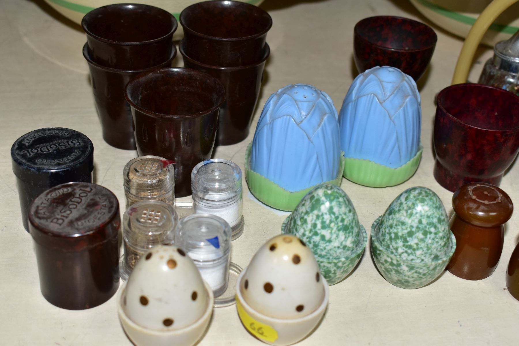 A SMALL COLLECTION OF BAKELITE AND PLASTIC CRUETS, EGG CUPS, etc, a pair of Royal Staffordshire - Image 4 of 5