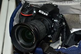 A NIKON D810 DIGITAL SLR CAMERA, fitted with a Nikkor AF 28-80mm f3.5 lens, a Homesuit battery (no