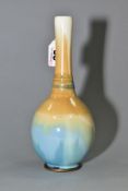 A SEVRES PORCELAIN SOLIFLEUR VASE OF GLOBE AND SHAFT FORM, multi-colour glazes with a blue