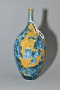 A SIMON RICH (BORN 1949) STUDIO POTTERY CRYSTALLINE GLAZED OVOID BOTTLE VASE, ochre ground with blue