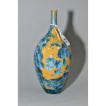 A SIMON RICH (BORN 1949) STUDIO POTTERY CRYSTALLINE GLAZED OVOID BOTTLE VASE, ochre ground with blue