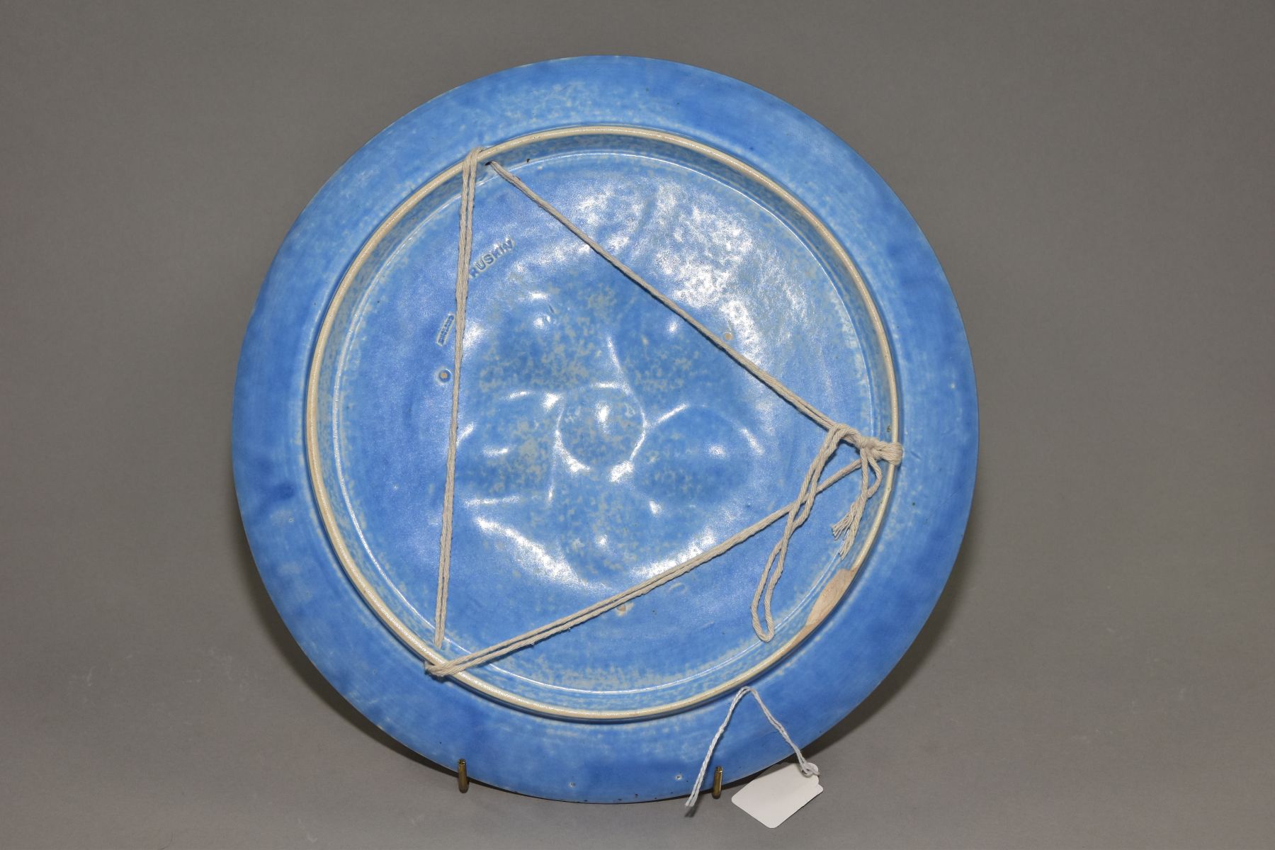 RUSKIN POTTERY, a circular wall plaque/plate, having a central embossed section, the whole covered - Image 4 of 5