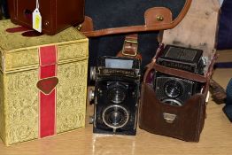 A ROLLEICORD 1 TAPETEN TLR CAMERA in untidy leather case with Anastigmat and Triotar 7.5cm f4.5