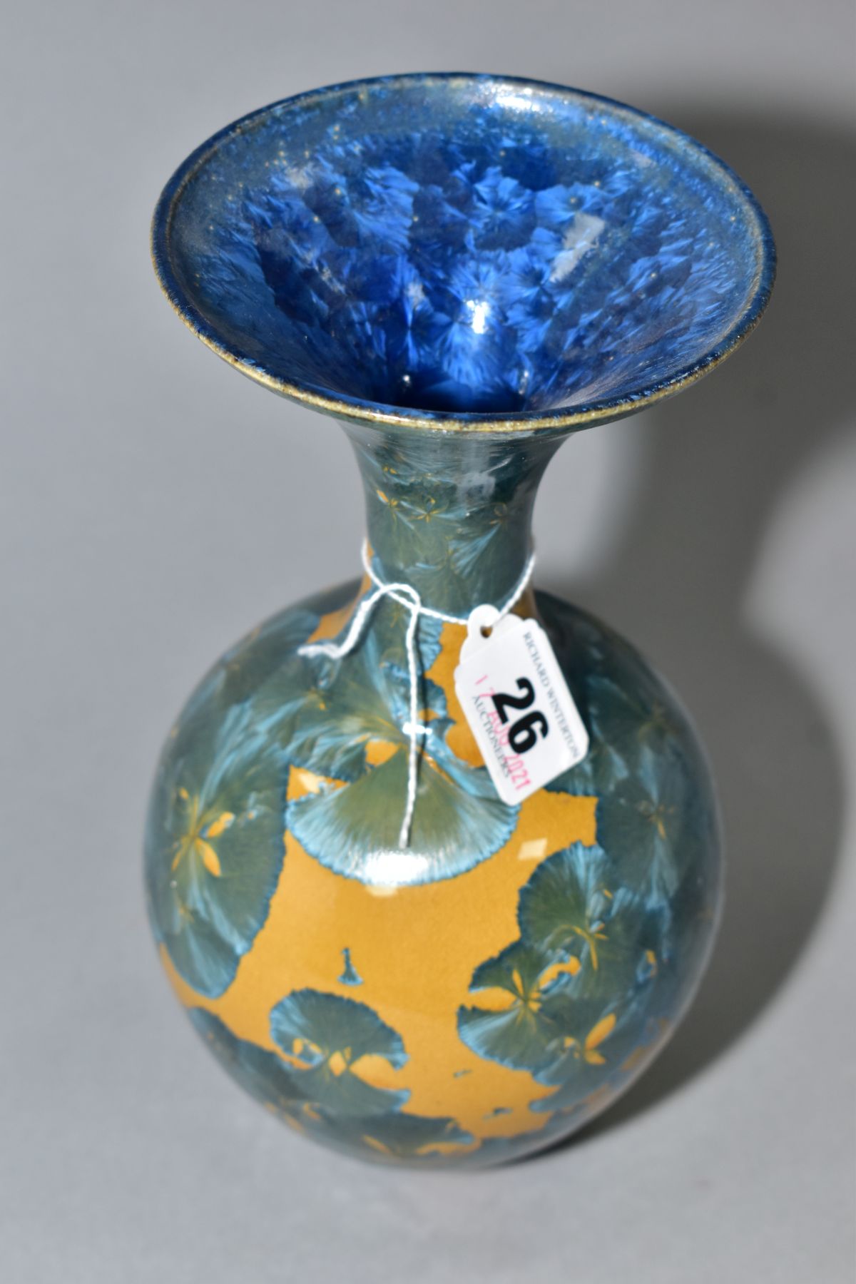 A SIMON RICH (BORN 1949) STUDIO POTTERY CRYSTALLINE GLAZED BOTTLE VASE, wide flared rim, ochre - Image 2 of 3