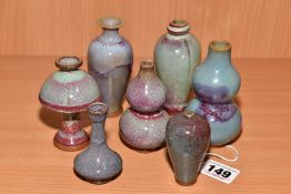 SEVEN MINIATURE CHINESE STYLE VASES, shapes include baluster, double gourd and garlic mouth, mottled