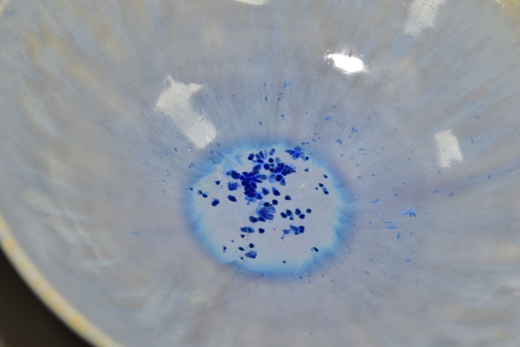 RUSKIN POTTERY, a shallow bowl raised on three feet, blue crystalline and streaked glaze, - Image 5 of 5