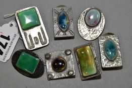 SEVEN RUSKIN STYLE BROOCHES, six enamels set into pewter mounts, one set into a mount stamped