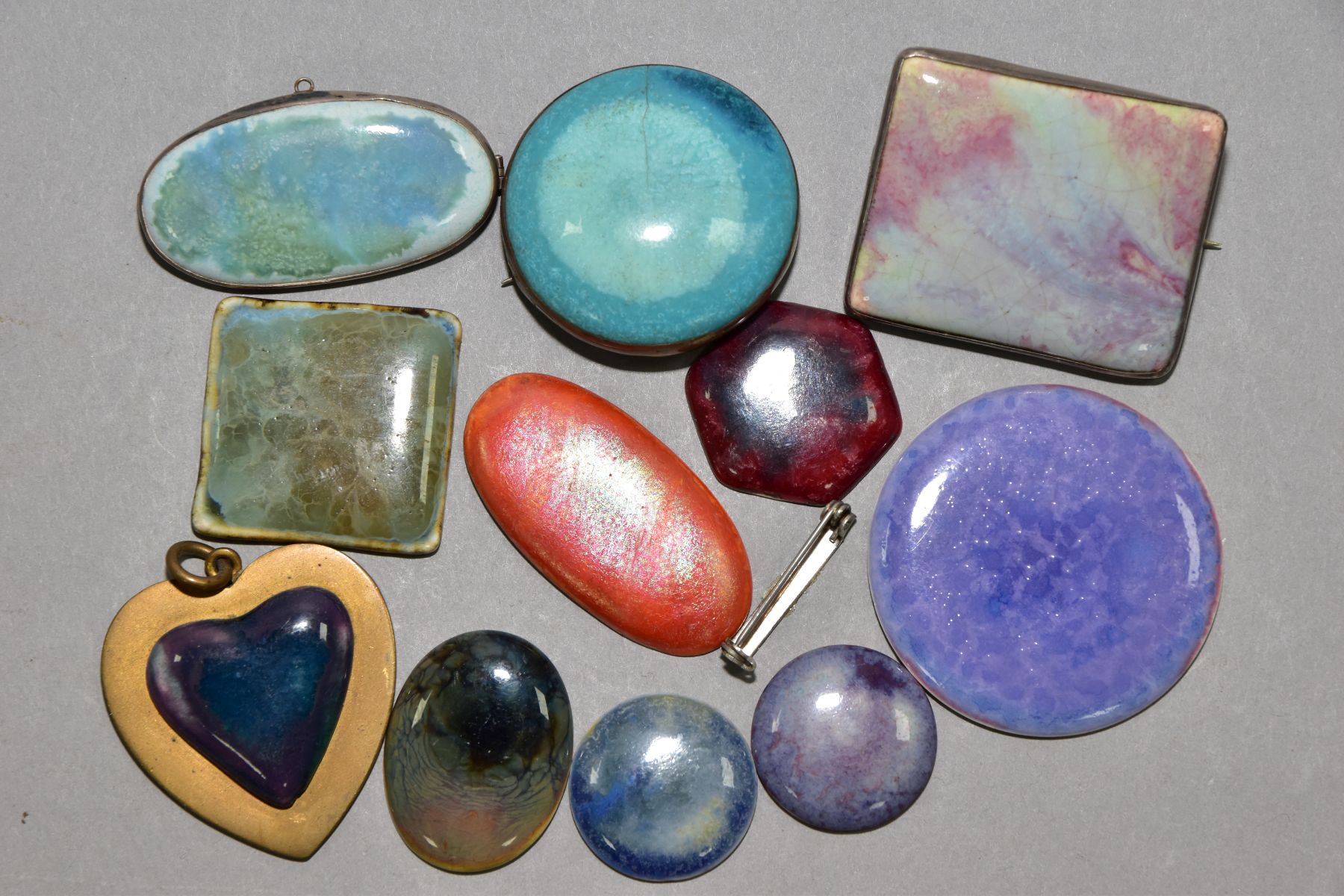 NINE RUSKIN ENAMELS, three mounted as brooches, together with two Ruskin style enamels, one