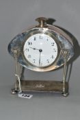 AN ARTS AND CRAFTS HAND HAMMERED SILVER PLATE ON COPPER MANTEL CLOCK, possibly by A.E Jones, knob