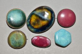 SIX RUSKIN AND RUSKIN STYLE BROOCHES, comprising three enamels impressed Ruskin, two with metal